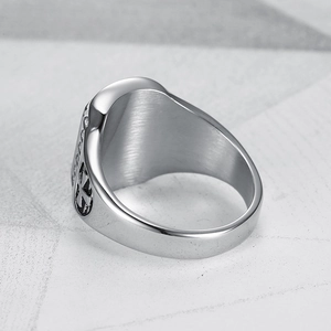 Men's titanium steel shield ring with cross relief and cubic zirconia inlay detail