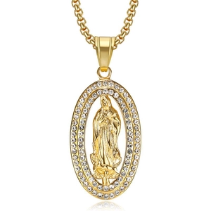 Macro detail of gold-plated Virgin Mary oval pendant with sparkling rhinestone frame