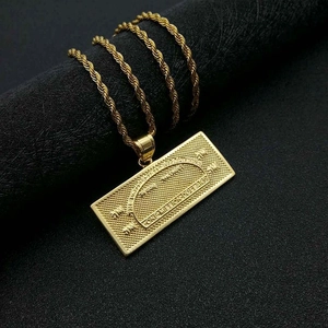 Iced out gold dollar sign necklace with rope chain and engraved one million pendant