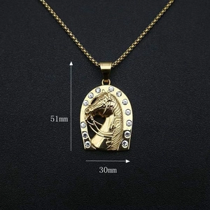 Macro view of gold plated horse head pendant showing 51mm height and 30mm width details