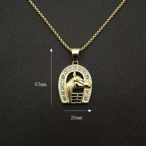 Detail view of gold-plated horse head pendant necklace showing 43mm by 26mm dimensions