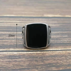 Macro shot of 20mm high vintage Celtic knot ring with rectangular black inlay and side carvings