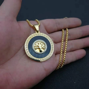 Gold plated Tree of Life pendant necklace with cubic zirconia and Greek key pattern