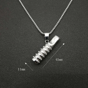Detail showing 45mm x 11mm silver steel pendant dimensions and white zircon inlay