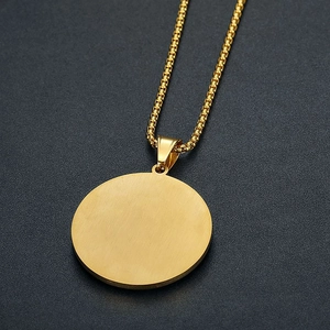 Close-up of gold-plated Masonic medallion pendant on a classic box chain necklace