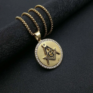 Detail of gold Masonic AG pendant with sparkling zircons and a classic box chain