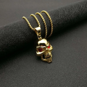 Collier tête de mort plaqué or hip hop avec yeux en cristal rouge et chaîne à billes