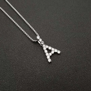 Close-up of silver letter A pendant with AAA cubic zirconia on a Venetian box chain