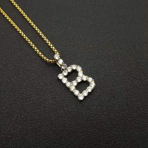 Macro shot of gold plated 316 stainless steel B pendant necklace with AAA zircon stones