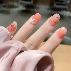 Coral orange nail stickers with ice cream patterns and white drip glaze effects