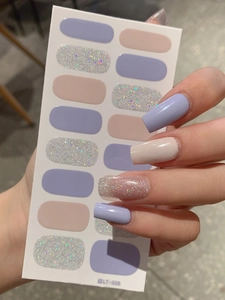 Detail of LT-006 nail stickers in lilac, cream, and silver glitter on hand and card
