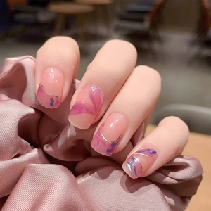 Pink jelly press-on nails with blue purple marble patterns and gold line accents