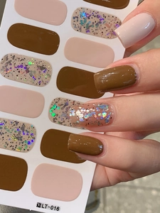 Macro shot of LT-016 nail wraps featuring coffee brown, beige, and holographic glitter
