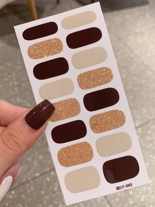 Detail of LT-003 nail stickers in solid brown, beige, and shimmering gold glitters
