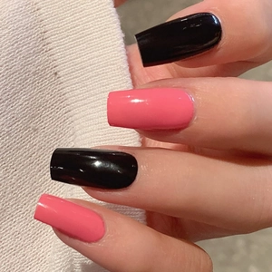 Glossy black and pink self-adhesive nail stickers on long square nails with knit background