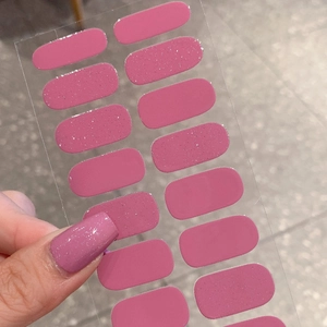 Dark pink nail polish stickers with fine glitter finish on a 14-piece adhesive sheet