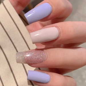 Purple and pink press-on nails with silver glitter in a square shape and glossy finish