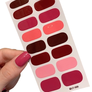 Self-adhesive solid color nail stickers in red and pink gradients with glossy finish