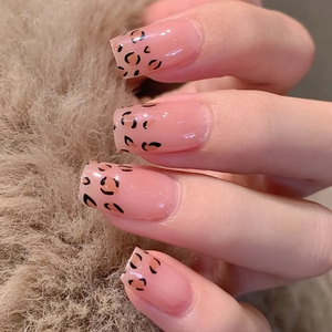 French leopard print nail stickers with light brown autumn design on plush background