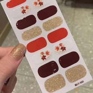Autumn maple leaf nail sticker set featuring red and gold glitter patterns for fall manicure