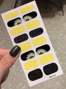 Macro view of self-adhesive yellow sunflower nail stickers featuring style LT-017