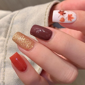 Autumn maple leaf nail stickers with burgundy, gold glitter, and orange nail art designs