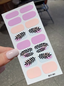 Close-up of minimalist leaf pattern nail stickers in soft pink and nude tones, model LT-061