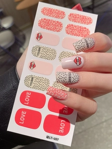 Detail of LT-057 Valentine nail stickers with heart patterns and YOU&ME text on models hand