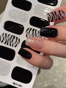 Detail view of LT-021 nail wraps with black, silver glitter, and zebra patterns