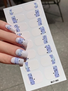 Detail of LT-063 nail stickers with lavender blue wave patterns and black polka dots