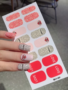 Detail of waterproof heart and dot nail stickers featuring YOU&ME and LOVE designs
