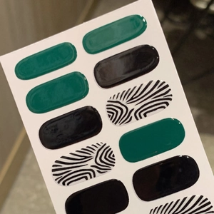 Waterproof nail polish stickers featuring black zebra stripes and dark green solid colors
