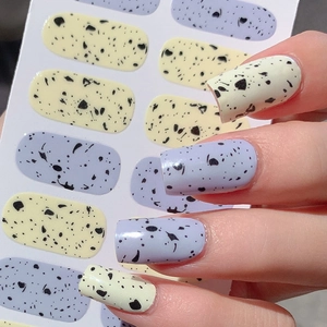 Easter egg shell pattern nail stickers with minimalist yellow and purple polka dot design