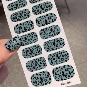 Easter eggshell teal nail stickers with black polka dots and leopard print patterns