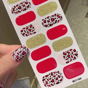 Red leopard print nail stickers with gold glitter and solid red adhesive nail wraps