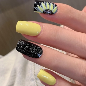 Waterproof sunflower nail stickers featuring bright yellow and black glitter patterns