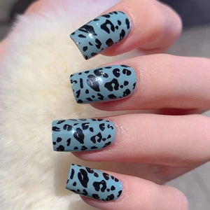 Light blue leopard print press-on nails in rectangular shape for Easter styling