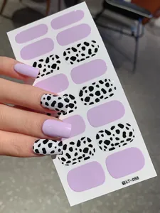 Detail of lavender and Dalmatian cow print nail stickers on sheet model LT-058