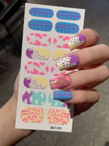 Detail of LT-070 nail wraps featuring blue stripes, pink cow print, and purple dots