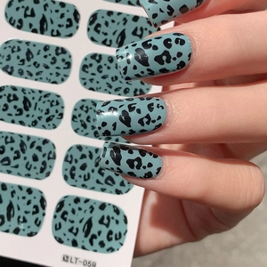 Blue leopard print Easter egg shell nail stickers with sample application on hand