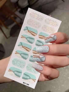 Detail of LT-066 blue marble nail wraps with abstract strokes and matte finish texture