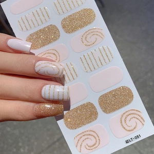 Light pink glitter nail stickers with gold line art and sequin patterns DIY kit