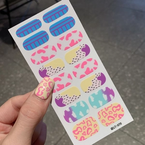 Self-adhesive nail polish wraps with colorful stripes, dots and cloud patterns