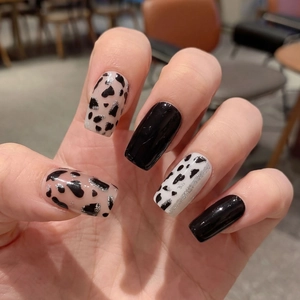 Chic leopard and cow print square nails with minimalist black and silver glitter accents