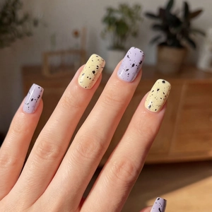 Light purple and yellow nail stickers with black quail egg texture in glossy finish
