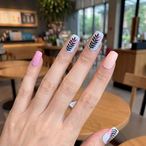 Elegant floral nail stickers with pink and leaf patterns on almond-shaped nails