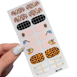 Western style LT-071 nail stickers with leopard, checkerboard and eye patterns on hand