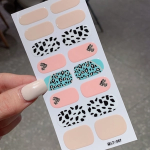 Mix of heart and animal print nail polish wraps including cow and zebra patterns