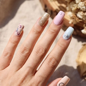 Artistic minimalist floral nail stickers featuring glitter and geometric line designs