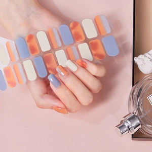 Rainbow gel nail stickers with orange marble design and high gloss finish for manicure